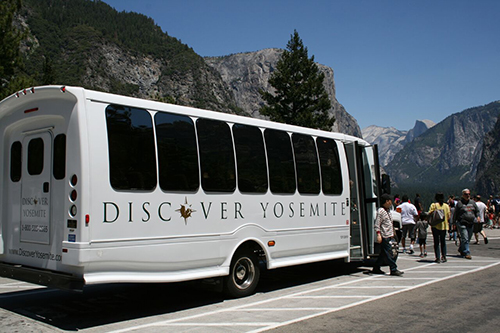 Tour Buses with People looking at Mountains